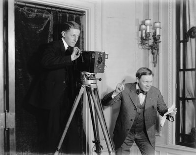Two Men Using a Movie Camera Indoors, c.1908-20 by Detroit Publishing Co.